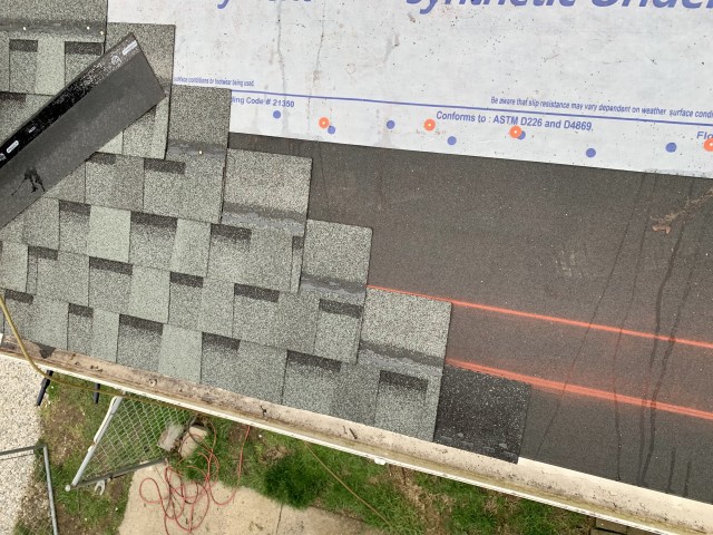 installing roof shingles